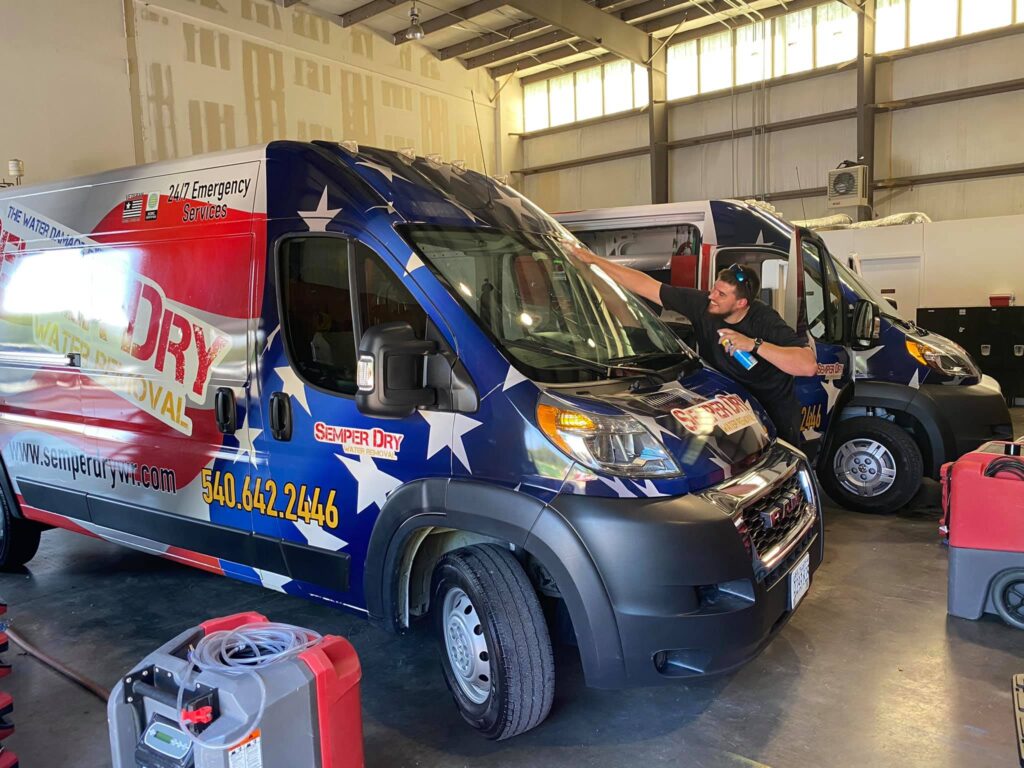 Semper Dry van with patriotic wrap parked inside warehouse