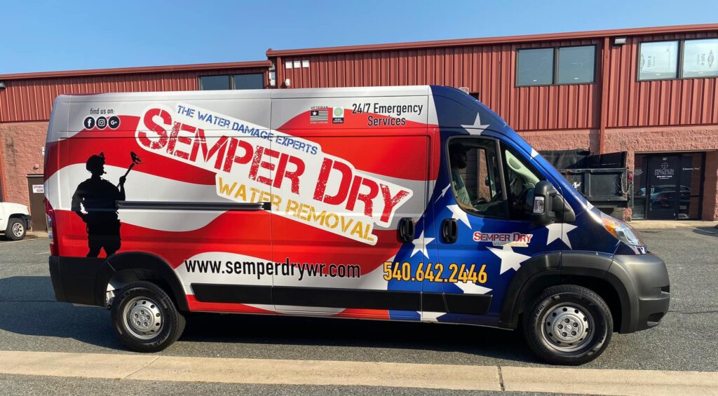 Side view of Semper Dry van with branding and contact information